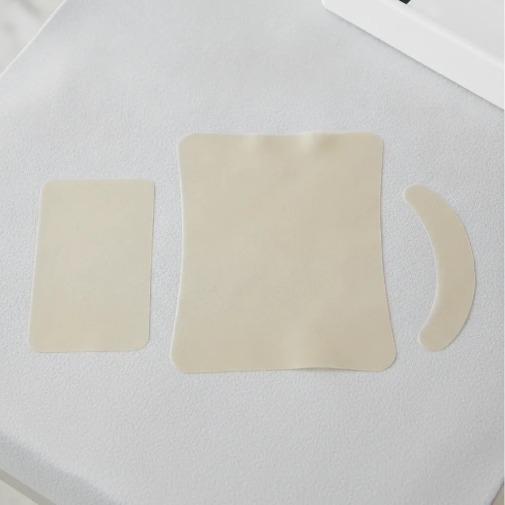 biodermis epi-derm silicone scar sheets and curved strip shown in a size and shape comparison